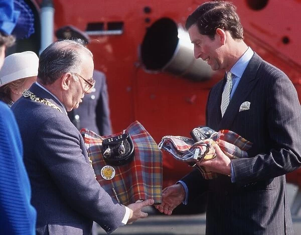 Prince Charles receiving a kilt from Lord Provost Robert Gray at the Glasgow Garden