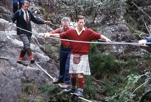 Prince Charles walking tightrope at Glen Coe and River Nevis, Scotland, August 1987