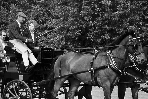 Prince Philip driving carriage with Nancy Reagan beside him - June 1982