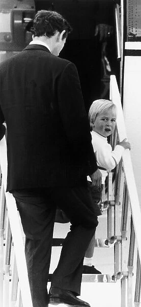 Prince William with Prince Charles at Aberdeen Airport, climbing the stairway to