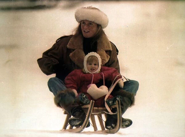 Princess Beatrice on the toboggan with mother on the back