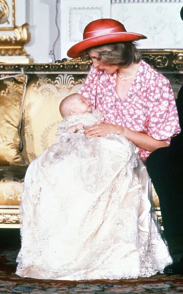 Princess Diana holds her son Prince William in her arms in the White Drawing Room of