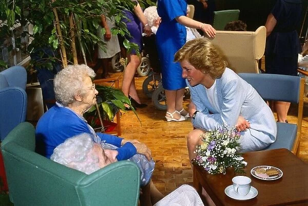 Princess Diana pictured with pensioner Helen McCaffrey during a visit to the Bo