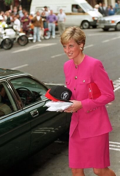 Princess Diana, wearing a pink jacket and skirt, visits the Theatre Museum in Covent