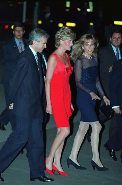 Princess Diana wears a red evening dress with red shoes