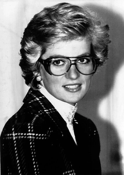 Princess Diana wears safety goggles and a Catherine Walker suit during a visit to a