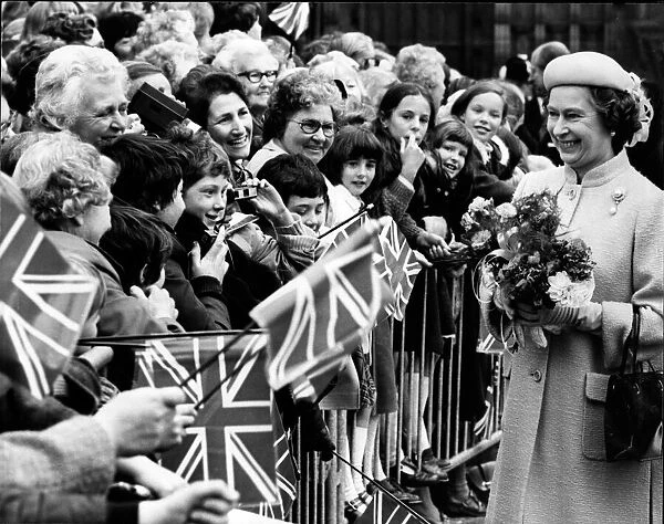 Queen Elizabeth II is all smiles as she meets the people of Warrington, Cheshire