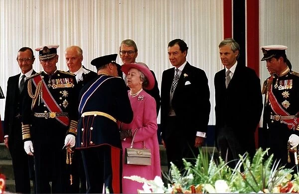 Queen Elizabeth II King Harald V of Norway kissing Queen pink coat hat Charlotte Square