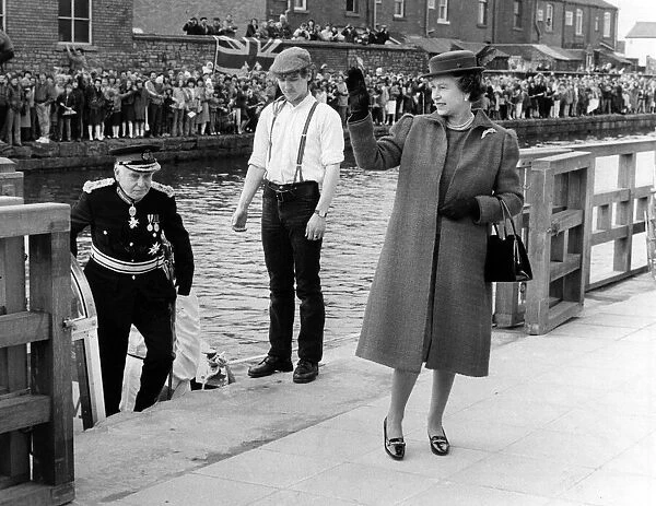 Queen Elizabeth II visits Wigan Pier. The Queen waves to the crowd on the Quayside