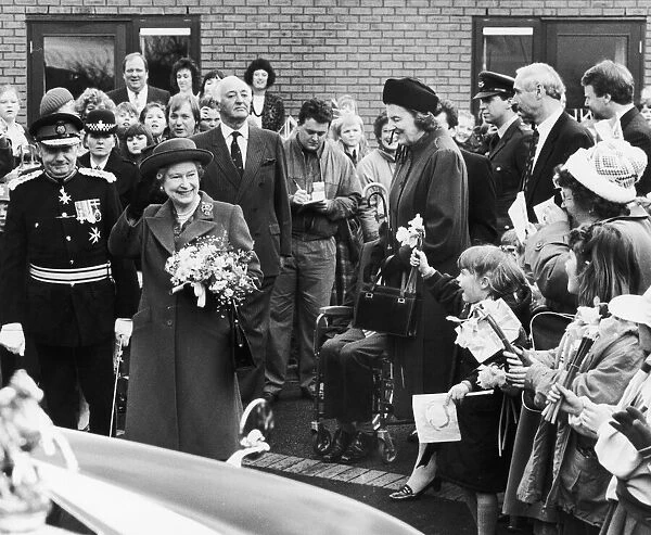 The Queen visits Manchester. Pictured here she waves to the crowd on her visit to