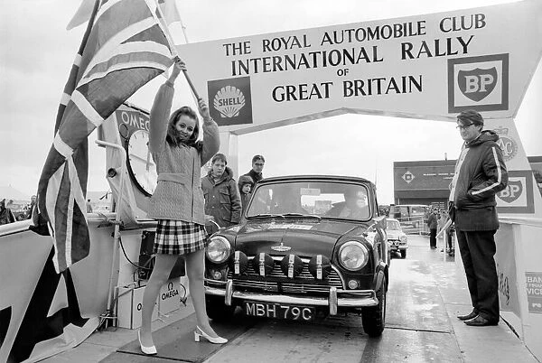 R. A. C. Rally: Miss U. K. Sheena Drummond, Waves the flag for the start of the R. A. C. Rally