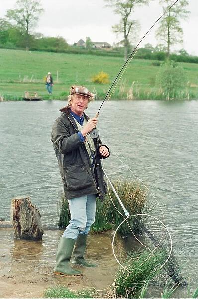 Radio Disc Jockey Chris Tarrant enjoying a spot of fishing in his spare time