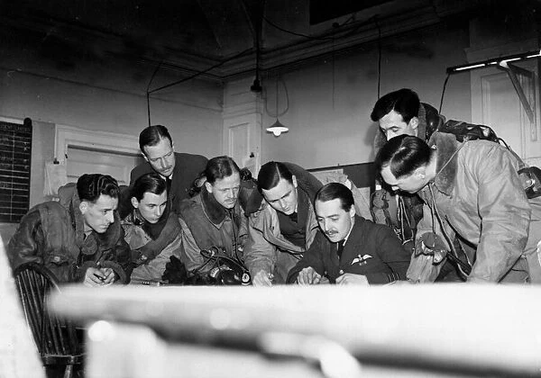 RAF air crew listen to the instructions of the Commanding officer during preparations for