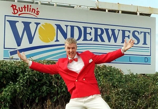 Redcoat Aidan welcomes visitors to Butlins Worderwest World Wonderwest World sign in
