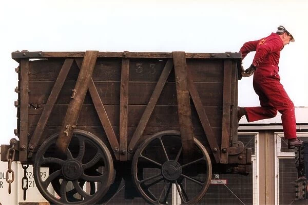 Restoration engineer Grodon Stark is helping to move an anciet wagon at the Stephenson