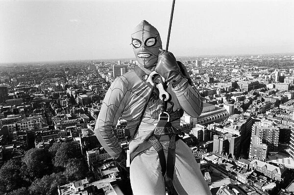 Richard Branson dressed as spiderman leaves the top of Centre Point. 2nd November 1985