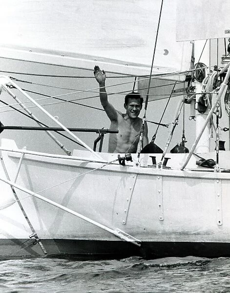 Robin Knox Johnston waves to his parents from his Suhaili boat at Falmouth before his