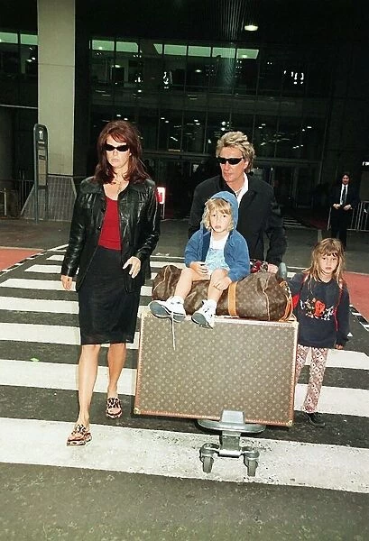 Rod Stewart April 1998 with wife Rachel Stewart and Children arriving at Heathrow