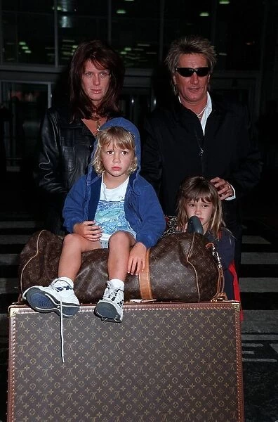 Rod Stewart Singer April 98 Arriving at Heathrow with his wife Rachel Hunter