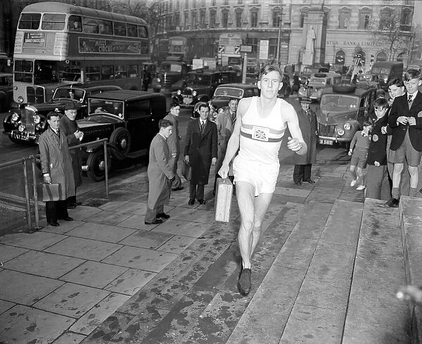 Roger Bannister arrives at St Martins in the Field with a red dispatch box. December 1952