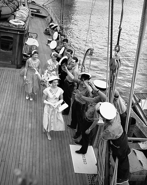 Sailors greet women on the deck of the sailing ship Creole at Dartmouth