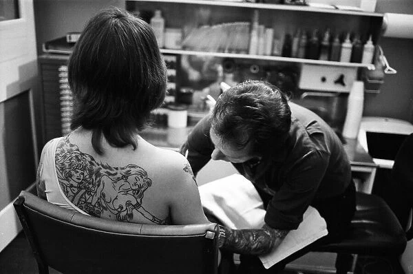 Scenes inside a tattoo parlour. 28th May 1981