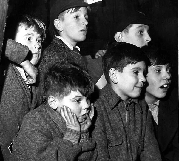 Schoolboys watching an exhibit at The Horticultural Hall They can stand on a Naval