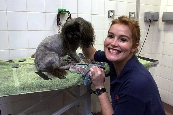 Shauna Lowry TV Presenter October 1999 giving Stimpy the dog a bath at Battersea
