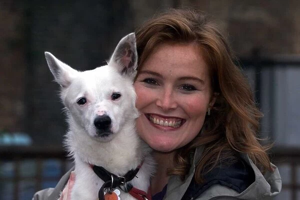 Shauna Lowry TV Presenter October 1999 with her pet dog Doc at Battersea Dogs Home