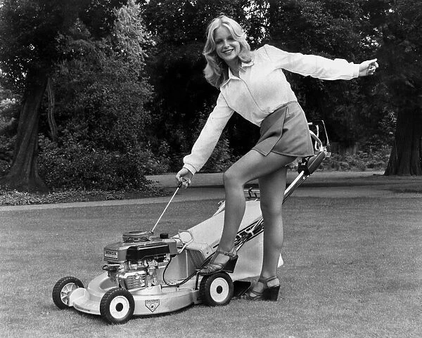 Shirley Johnson from Bristol shows off a new Honda HR 21 lawnmower, Augsut 1978