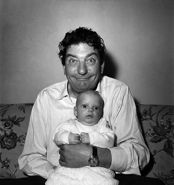 Sid Field with baby. September 1948 O14844