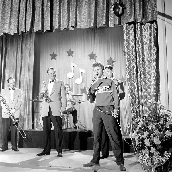 Singer Tommy Steel seen here performing. 1957 A397-003