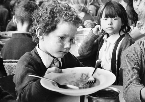 Please sir, I want some more, this little boy has enjoyed his school meal