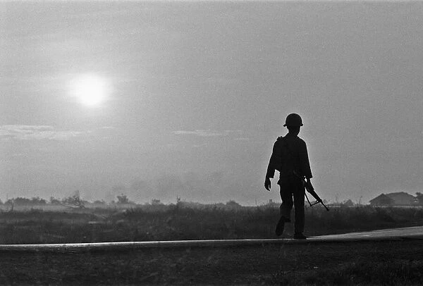 A soldier of the South Vietnamese army advances on Viet Cong positions in Trang Bang just