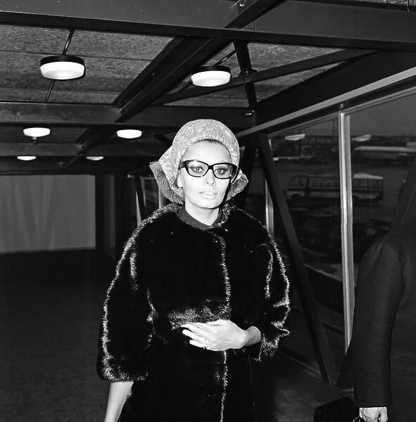 Sophia Loren leaving London Airport for Paris. November 1965