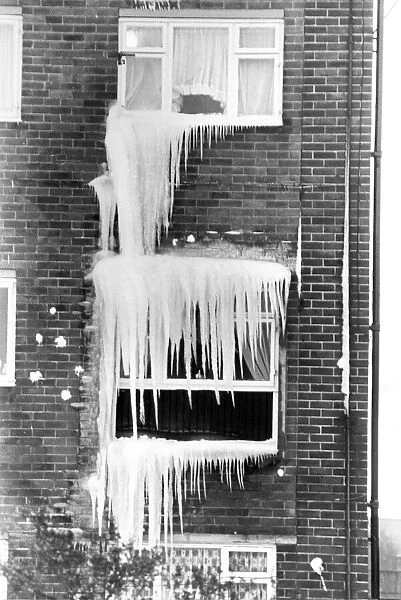 Some spectacular icicles hanging from windows in a block of flats in Wiltshire Gardens