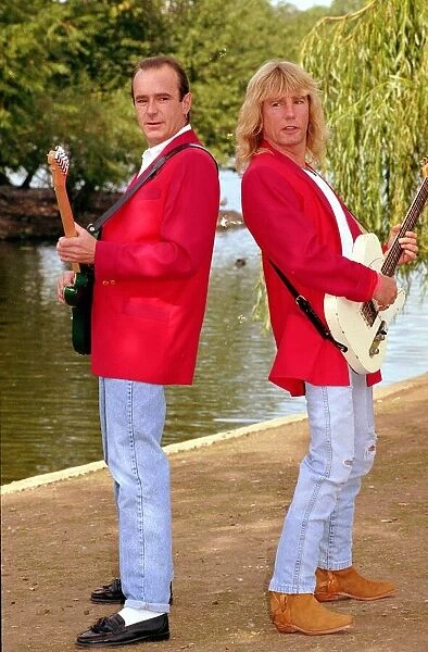 Status Quo wearing red coats at Butlins holiday camp. September 1990 1990s