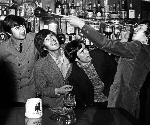 Steve Winwood with the Spencer Davis Group celebrating his by 18th Birthday drinking a