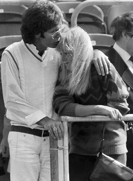 Sue Barker and Cliff Richard kissing in stands at tennis tournament - June 1983