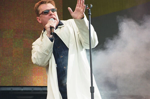 Suggs, lead singer of British ska group Madness, performing at Party in the Park at Hyde