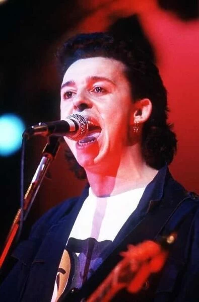 Tears For Fears singer Roland Orzabal on stage in concert