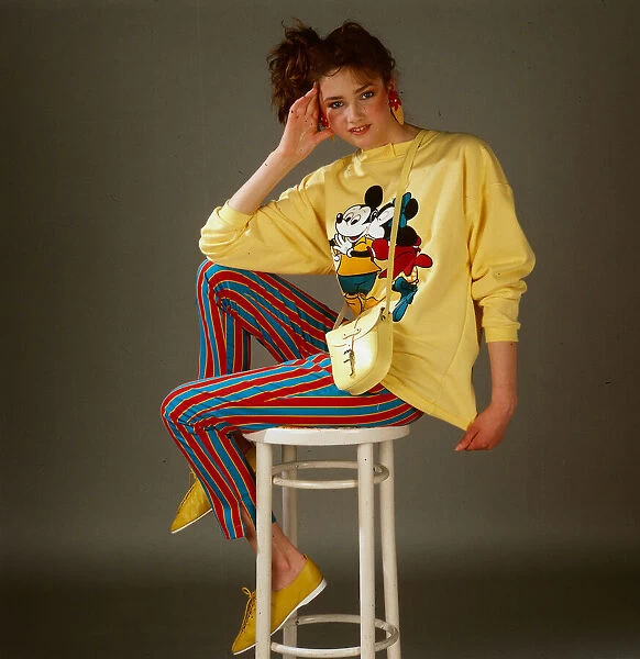 Teenagers dress and fashion, April 1987 Model wearing Mickey Mouse yellow