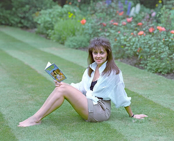 Television Presenter Carol Vorderman posing with her book Dirty