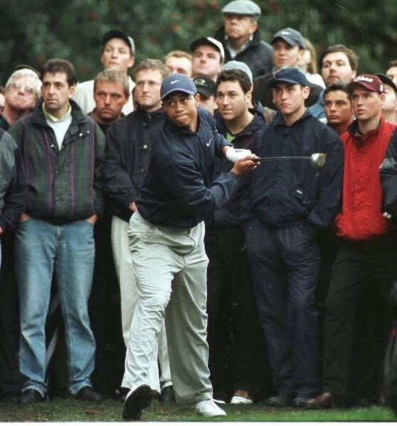 Tiger Woods slices the ball to the 18th green October 1998 during the World Matchplay at