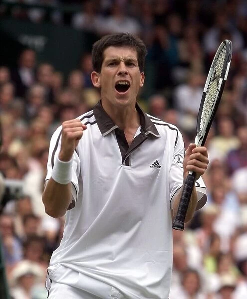 Tim Henman celebrates victory over Jim Courier in the fourth round mens single