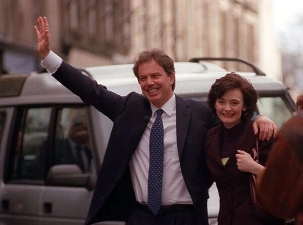 Tony Blair with arm around his wife waving to crowds while in Stirling April 1997