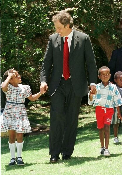 Tony Blair South Africa Visit January 1999 with the Aids child he sponsors at