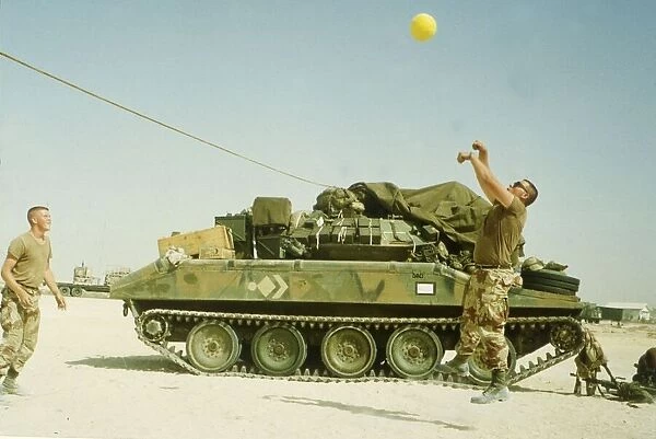 US troops play volley ball to pass the time during the build up of force before the start