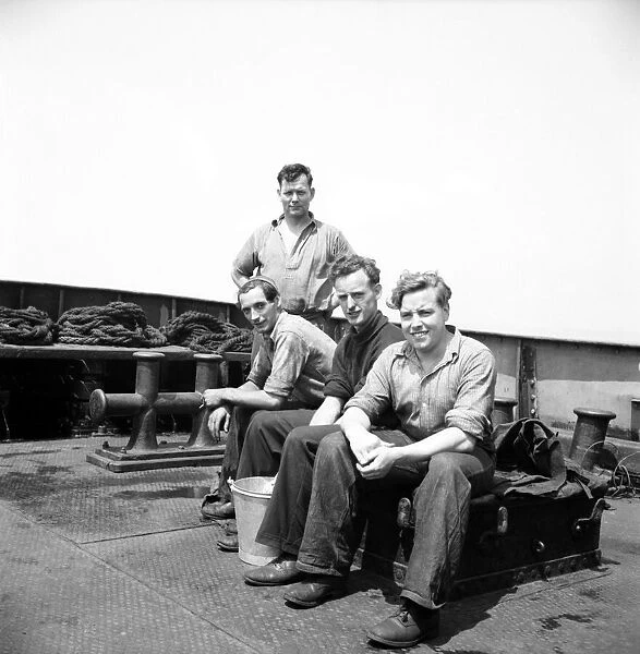 Tug boat crew seen aboard ship. June 1952 C3046