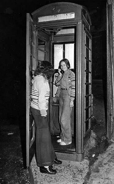 Twelve-year-old Martine Coles makes a call from the phone box in Pontypridd that is going